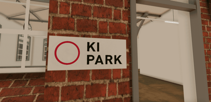 KI_Park Ein rotes Backsteingebäude mit einem Schild mit der Aufschrift „Ki Park“, das ein KI-Flaggschiff im Herzen eines Innovationsökosystems und KI-Netzwerks präsentiert.